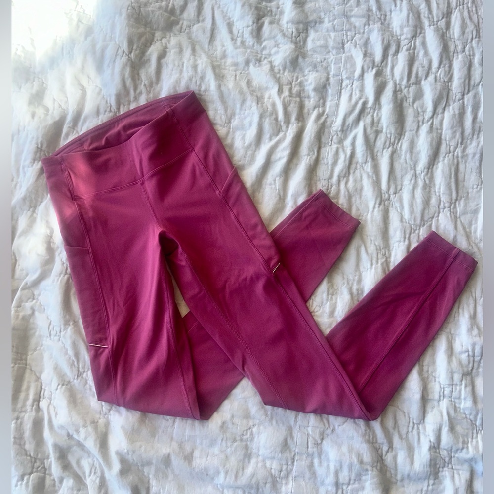 Dark pink Lululemon tights. Size 4, 25” I believe.